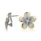 The photo is a medium size pair of yellow gold vermeil and sterling silver rhodium plated plumeria clip earrings with cubic zirconia stones. 