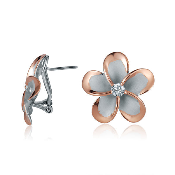 The photo shows a large size of rose gold vermeil and sterling silver rhodium plated plumeria clip earrings with cubic zirconia. 