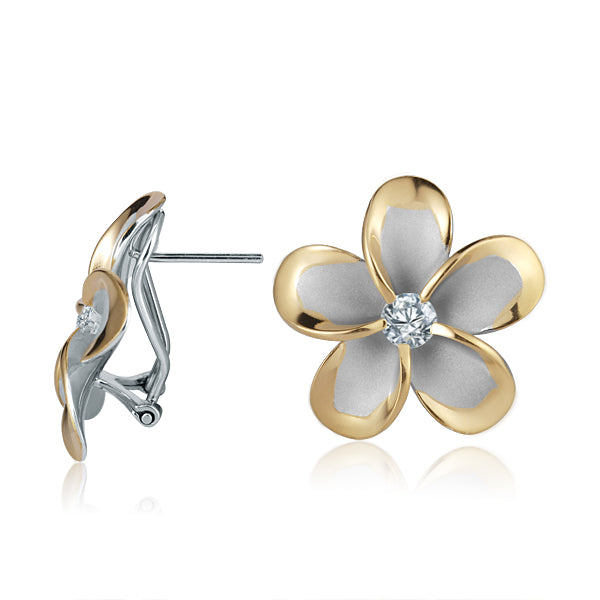 The photo shows a pair of large yellow gold vermeil and sterling silver rhodium plated plumeria clip earrings with cubic zirconia. 