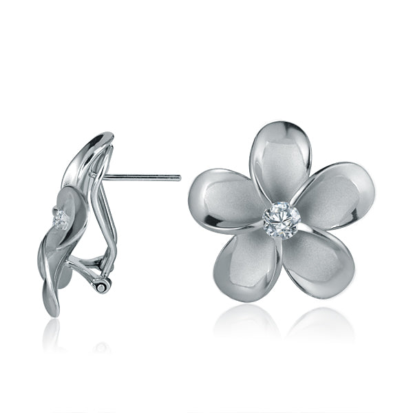 The photo shows a large pair of white gold vermeil and sterling silver rhodium plated plumeria clip earrings with cubic zirconia. 