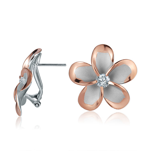 The photo shows a large pair of rose gold vermeil and sterling silver rhodium plated plumeria clip earrings with cubic zirconia. 