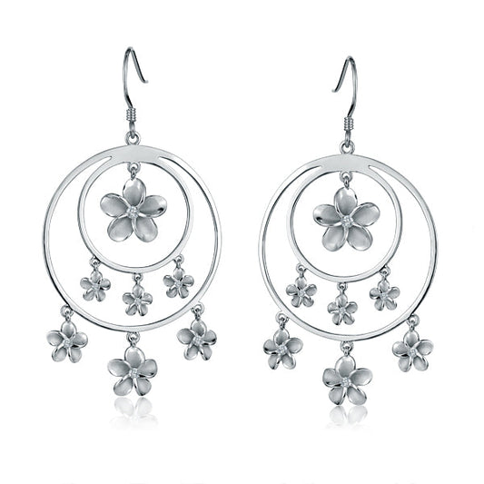 The photo shows a pair of sterling silver rhodium plated double circle hook earrings featuring seven plumerias with cubic zirconia. 