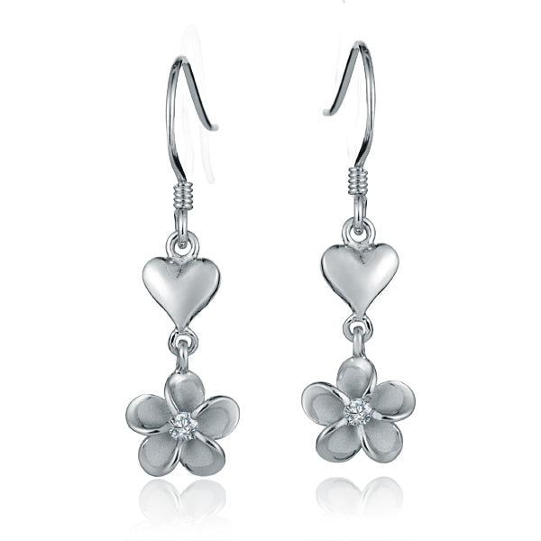 The picture shows a pair of white gold vermeil heart hook earrings featuring a plumeria design with cubic zirconia. 