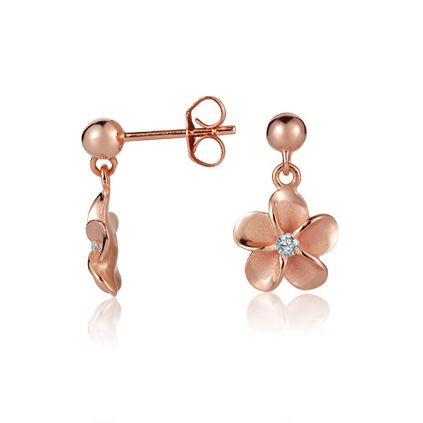 The photo is a pair of rose gold vermeil plumeria stud earrings with cubic zirconia. 