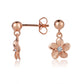 The photo is a pair of rose gold vermeil plumeria stud earrings with cubic zirconia. 