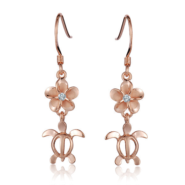The photo shows an 8 mm pair of rose gold vermeil plumeria and sea turtle hook earrings with cubic zirconia.