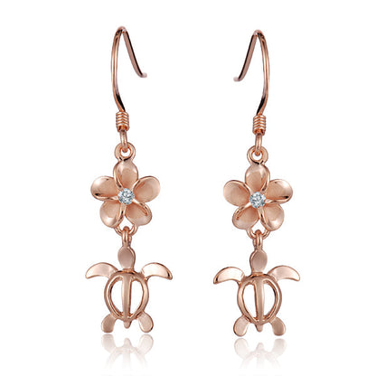 The photo shows an 8 mm pair of rose gold vermeil plumeria and sea turtle hook earrings with cubic zirconia.