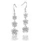 The photo show sterling silver rhodium finish plumeria flower hook earrings with cubic zirconia. 