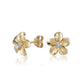 The photo shows a pair of yellow gold vermeil flower stud earrings with cubic zirconia. 