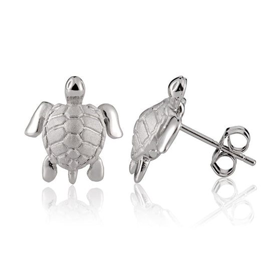 The photo shows a pair of sterling silver sea turtle stud earrings 