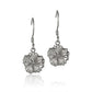 The photo shows a pair of white gold vermeil hibiscus hook earrings. 